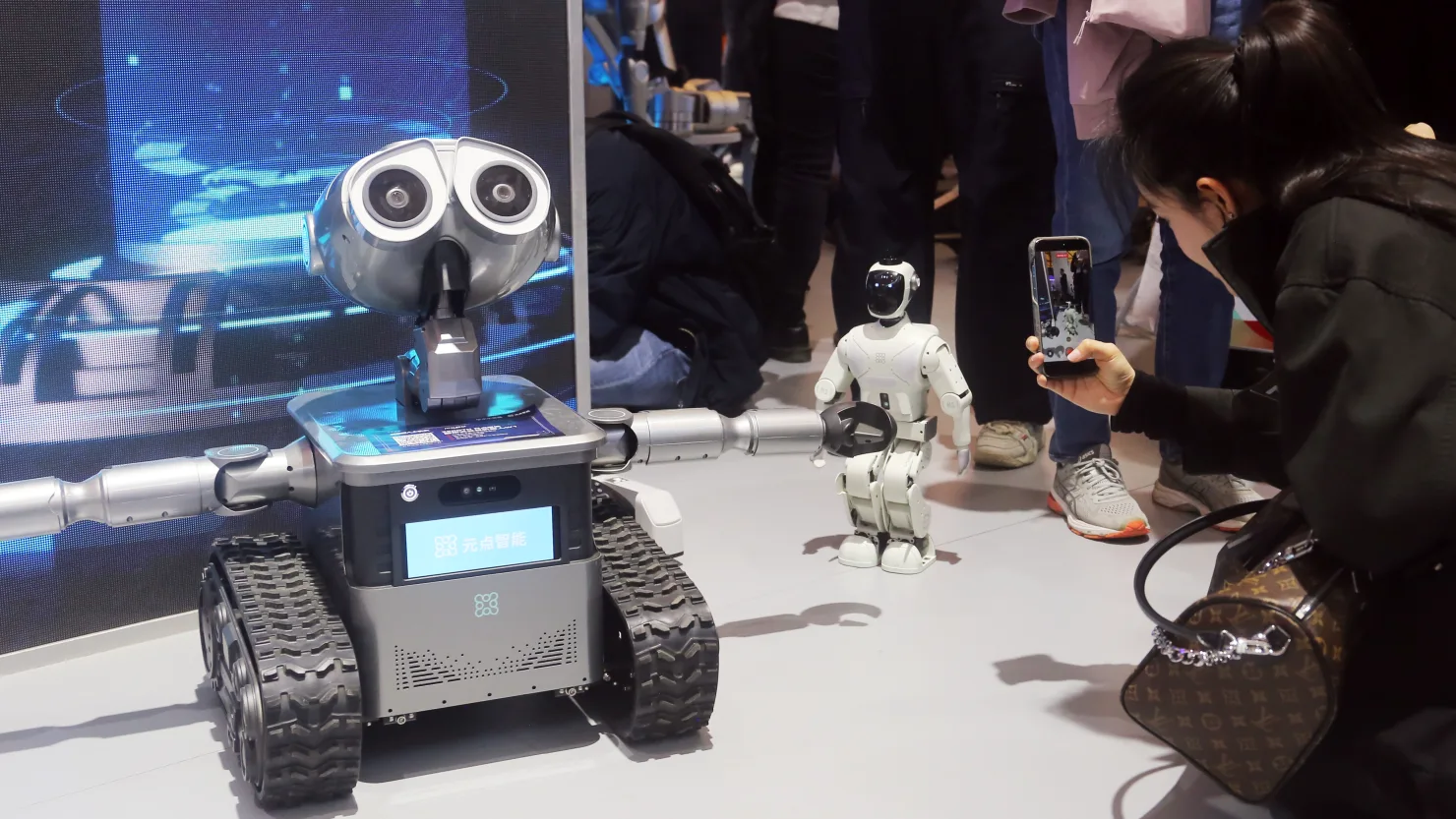 Humanoid robots on display at a technology expo in China, a sector Ant Group is investing in heavily