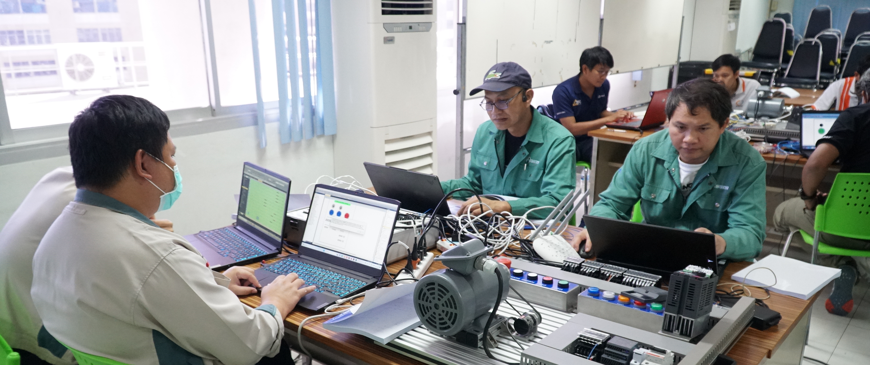 Workers in an office environment in Southeast Asia, where generative AI exposure is concentrated in clerical and professional roles