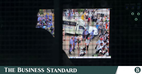 Police surveillance van with telescopic camera mast at a protest site in New Delhi