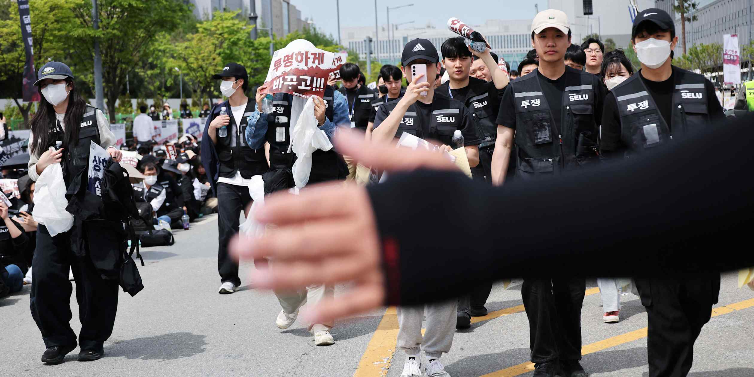 Workers outside a Samsung Electronics semiconductor facility in South Korea