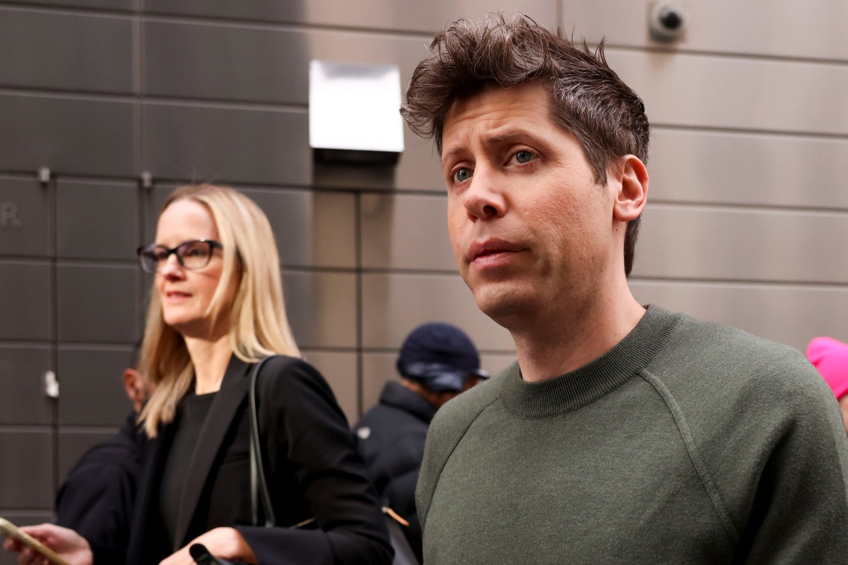 OpenAI logo displayed on a smartphone in front of courtroom imagery